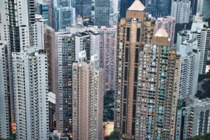 Panoramic view of towering skyscrapers on Hong Kong Island. Urban architecture captured from above.