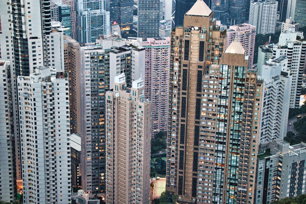 Panoramic view of towering skyscrapers on Hong Kong Island. Urban architecture captured from above.